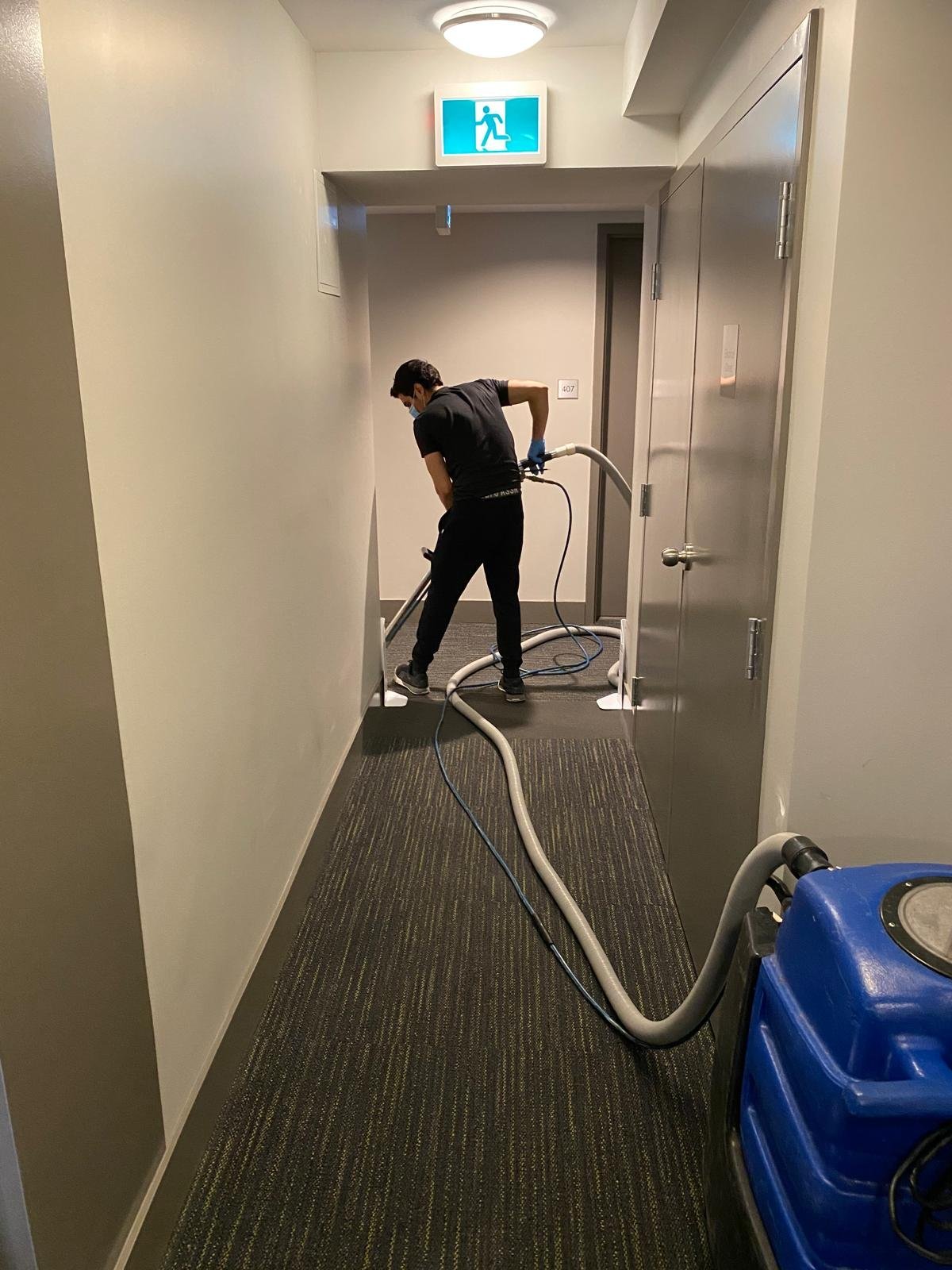 NJ Building Maintenance team cleaning a commercial corridor