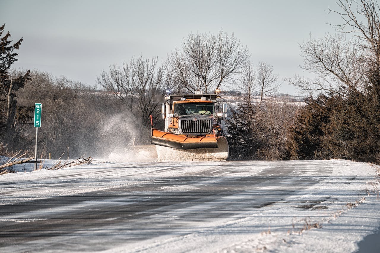 Snow plow clearing a commercial route